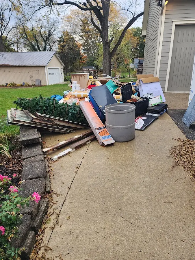 Dumpster being loaded with debris for 30 Yard Dumpster Rental in Shrewsbury